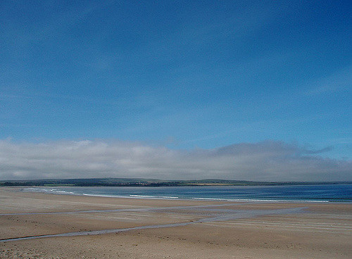 Backed by rolling sand dunes, Dunnet Bay stretches out for over 2 miles, and is a lovely sheltered spot for paddling and other beach activities. Photo credit: Adrienne Reid